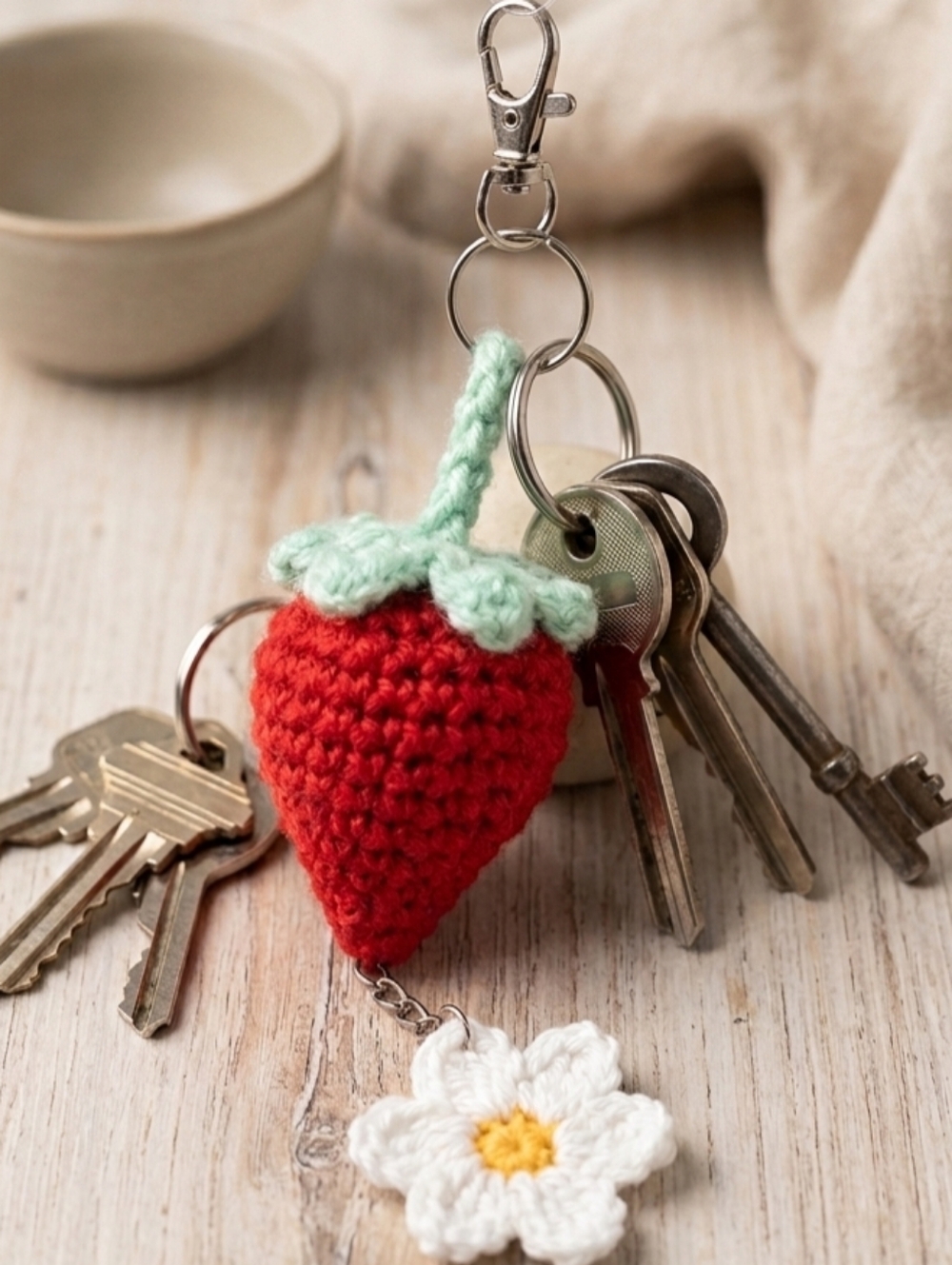 Handmade Red Crochet Strawberry Keychain with Mint Green Top and Daisy Charm